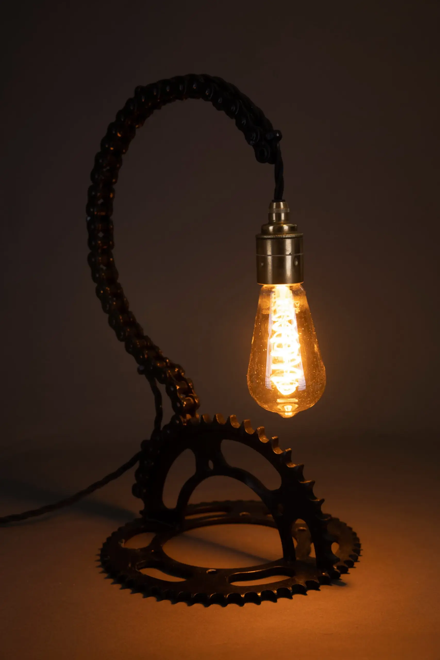 Handmade lamp built from bicycle chain and sprocket