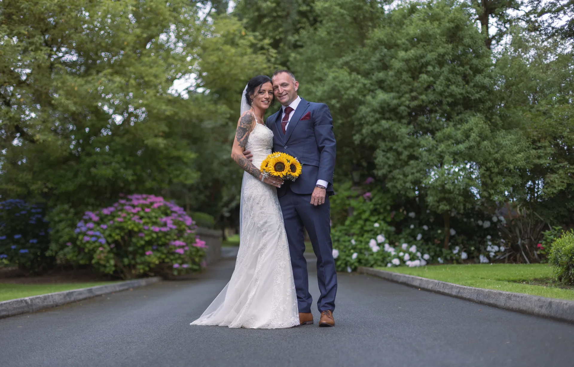 Wedding couple walking in a garden
